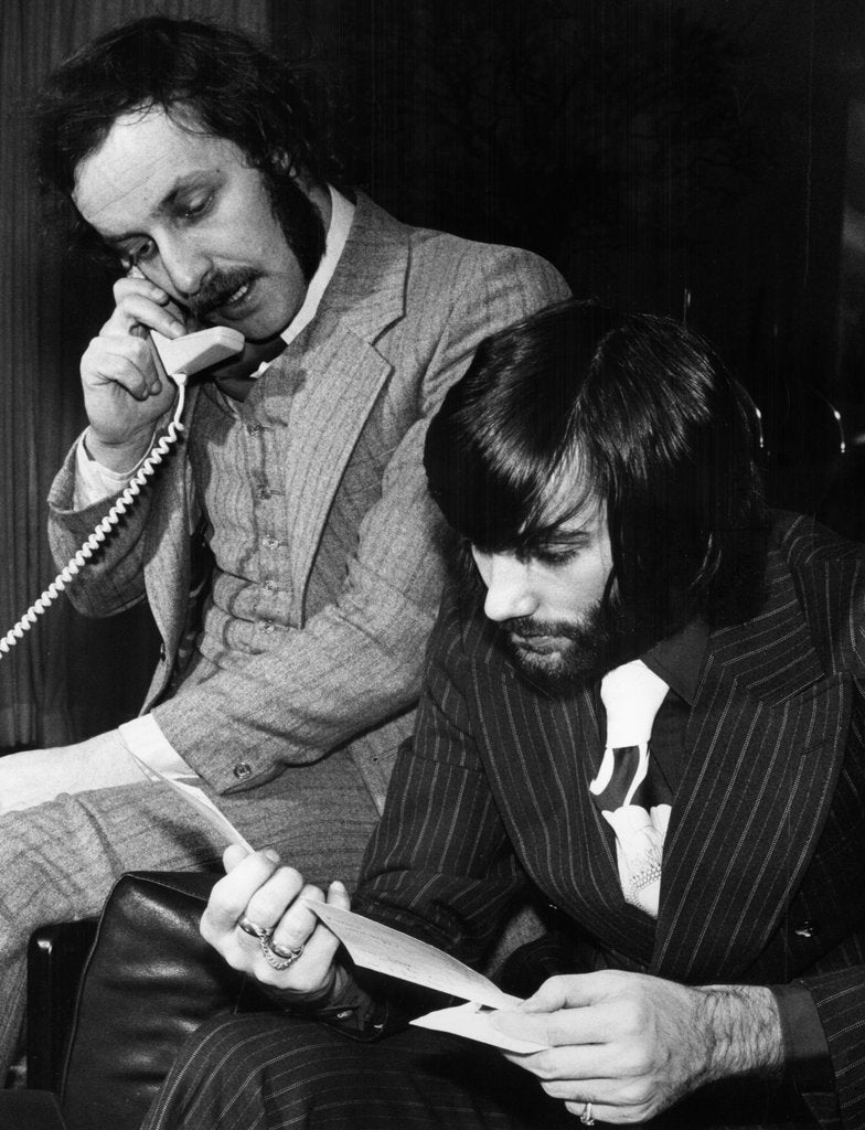 George Best and his business partner Malcolm Mooney by Staff