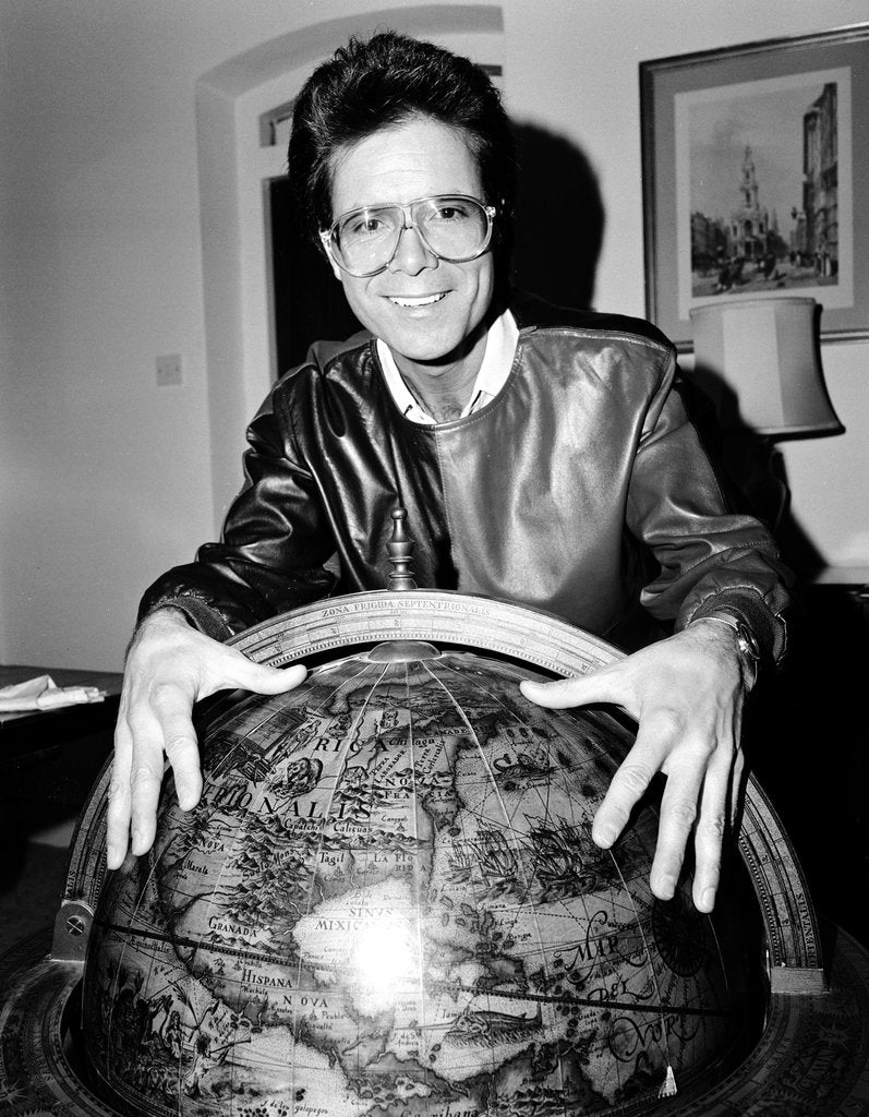 Detail of Cliff Richard with a globe by Anonymous