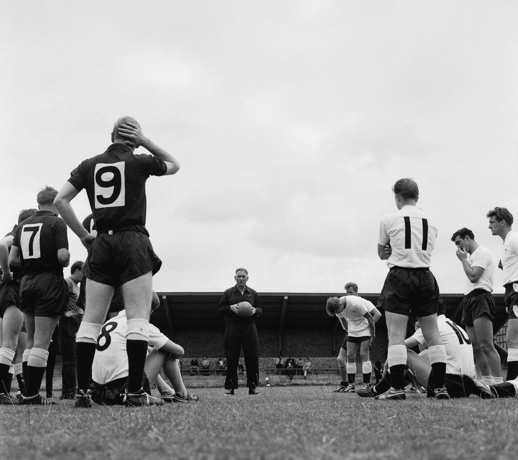 Detail of Tottenham Hotspur players listen to their manager Bill Nicholson by Blandford
