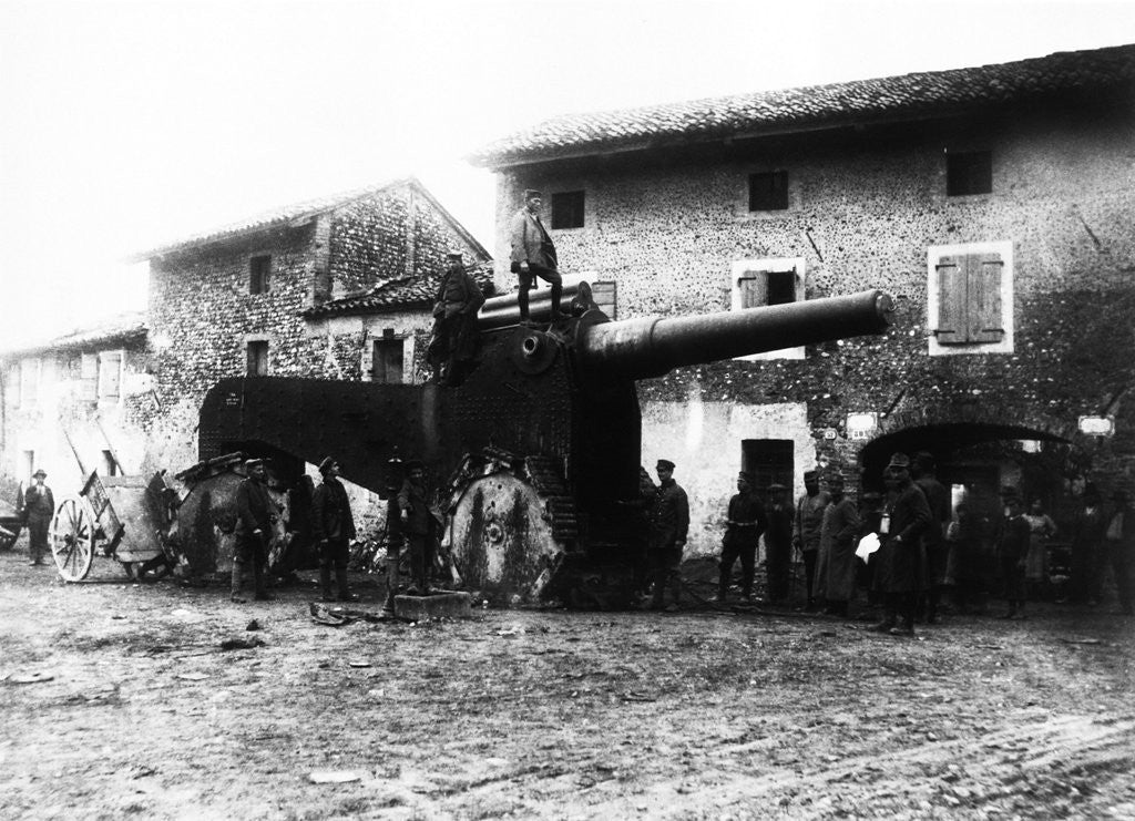 Detail of German troops examine heavy and gigantic cannons deserted by fleeing Italians in a village behind Udine. by Anonymous