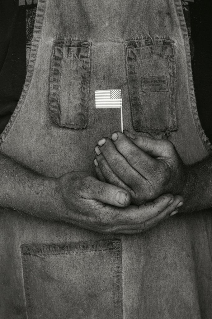 Detail of Man Holding Small American Flag by Anonymous