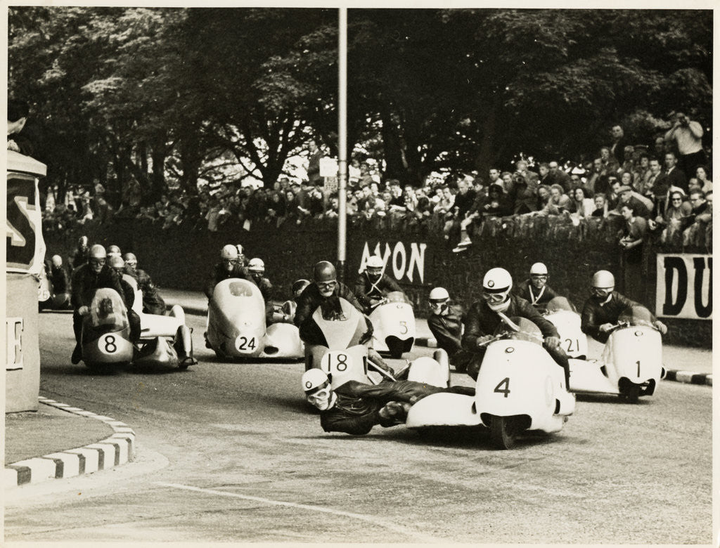 Detail of L. Neusser, driving a BMW sidecar outfit leads the field around Parkfield Corner, following the mass start of the1958 Sidecar TT by T.M. Badger