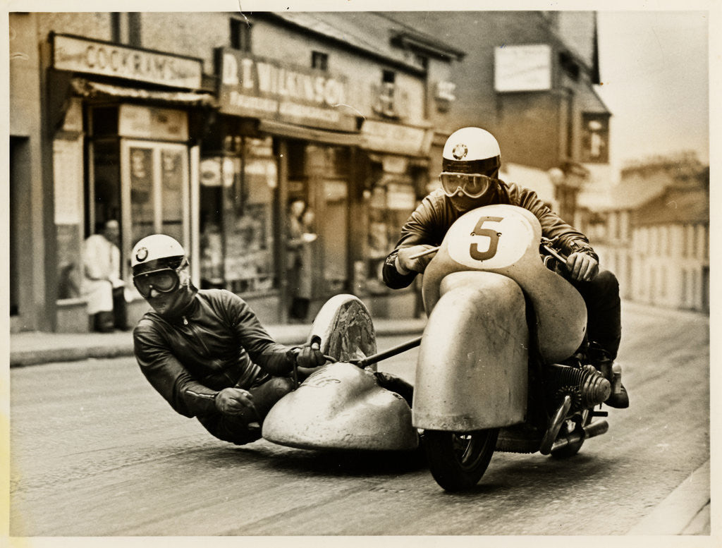 Detail of BMW sidecar outfit (number 5) passing through Onchan village by T.M. Badger