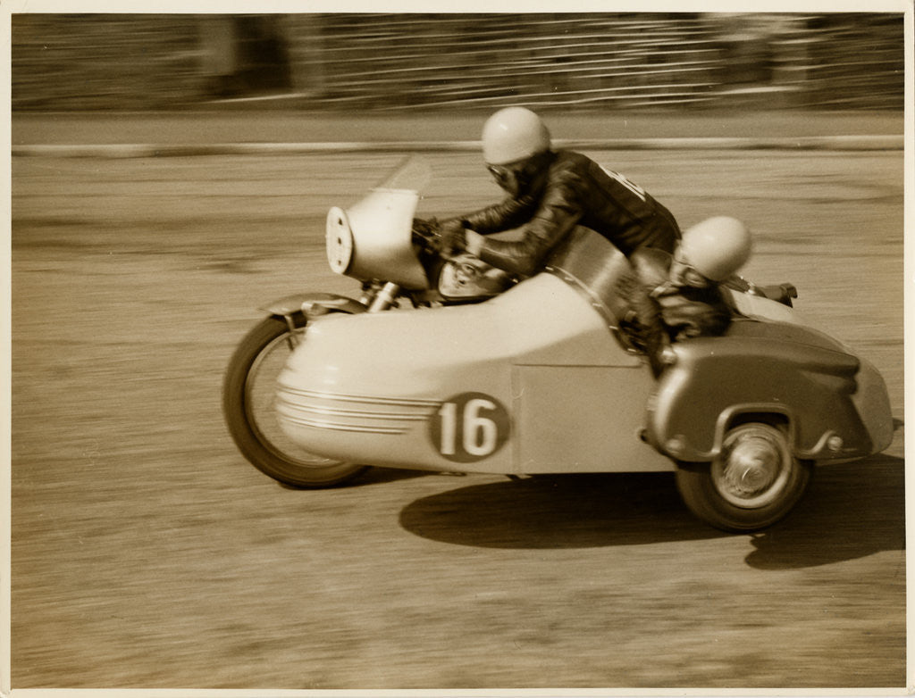 Detail of Eric Oliver driving sidecar outfit (number 16), 1958 (?) Sidecar TT (Tourist Trophy) by T.M. Badger