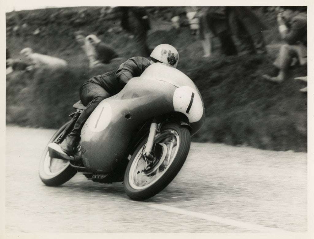 Detail of Bob McIntyre, TT (Tourist Trophy) rider, riding 499cc Norton (number 1) over the Mountain by T.M. Badger