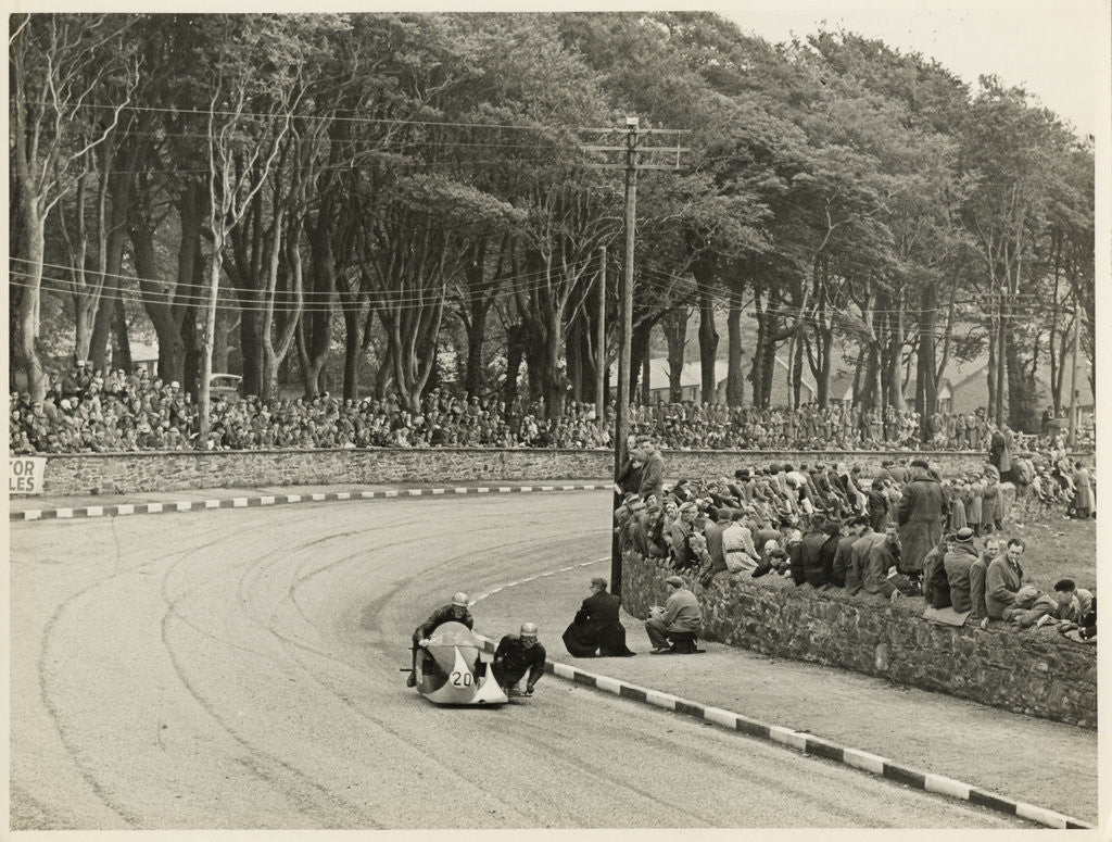 Detail of TT (Tourist Trophy) sidecar outfit (number 20) at Nursery Bends (?) by T.M. Badger