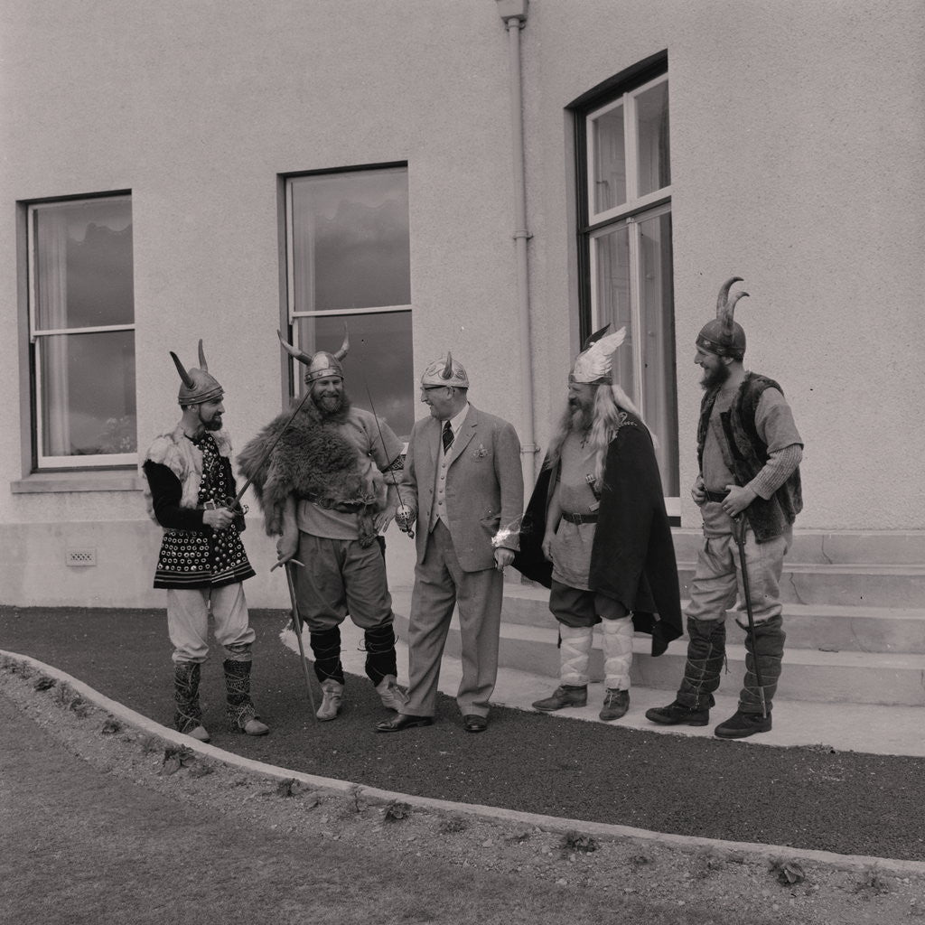 Detail of Lieutenant Governor Sir Ronald Herbert Garvey given a Viking helmet by Manx Press Pictures