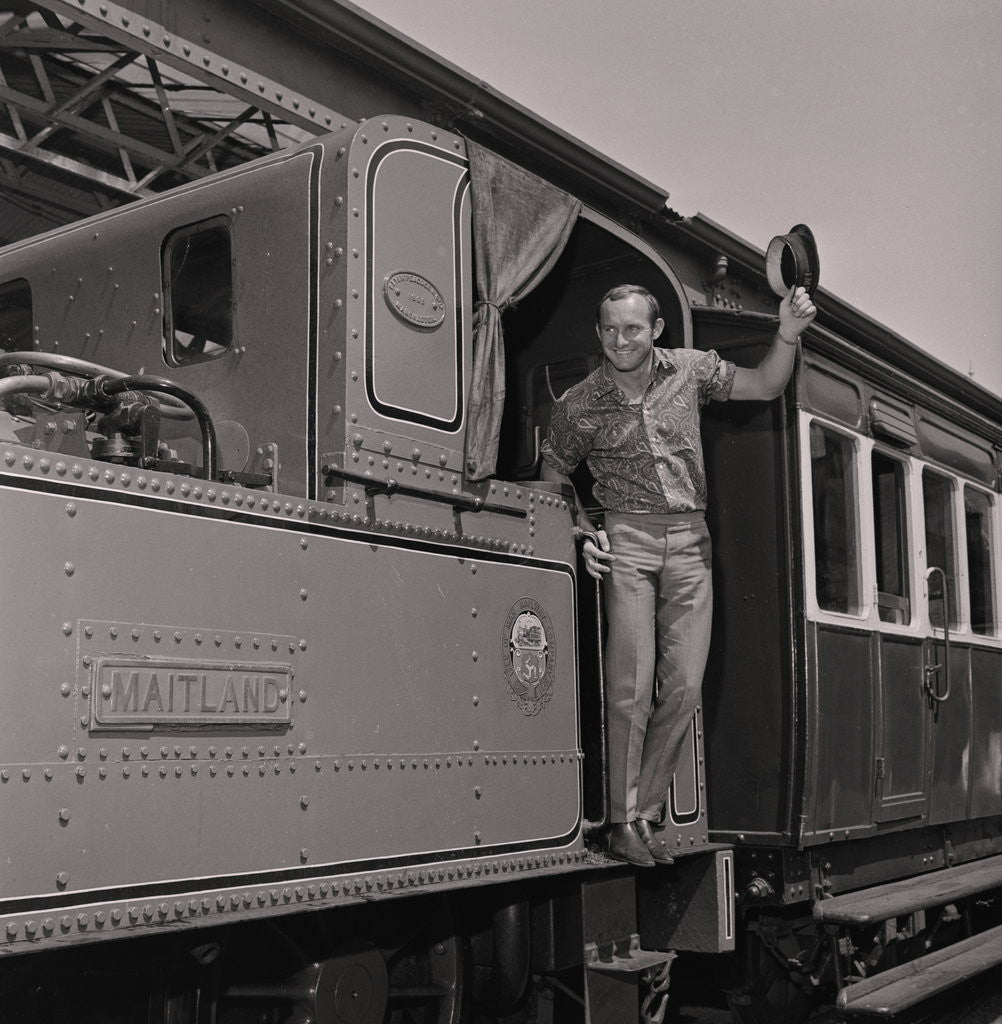 Detail of Mike Hailwood on steam train by Manx Press Pictures