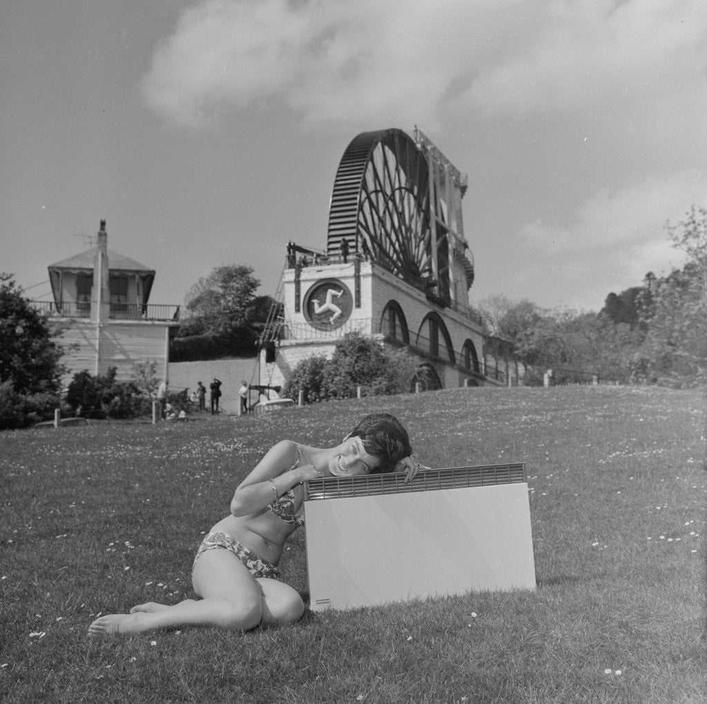 Detail of Woman in bikini advertising portable electric heater, Laxey Wheel by Manx Press Pictures