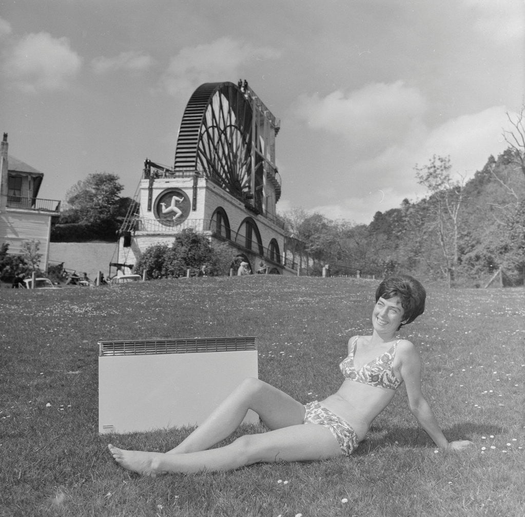 Detail of Woman in bikini advertising portable electric heater, Laxey Wheel by Manx Press Pictures