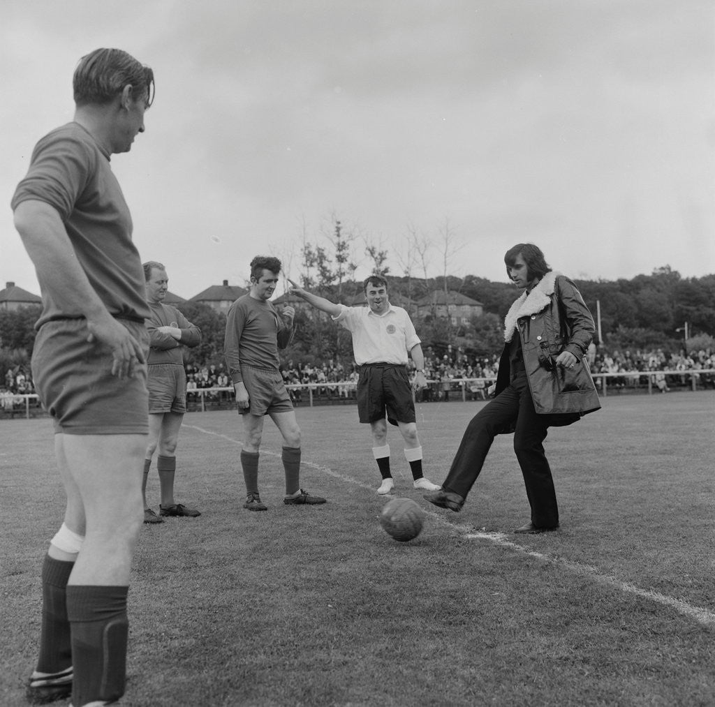 Detail of George Best kicking-off charity football match by Manx Press Pictures