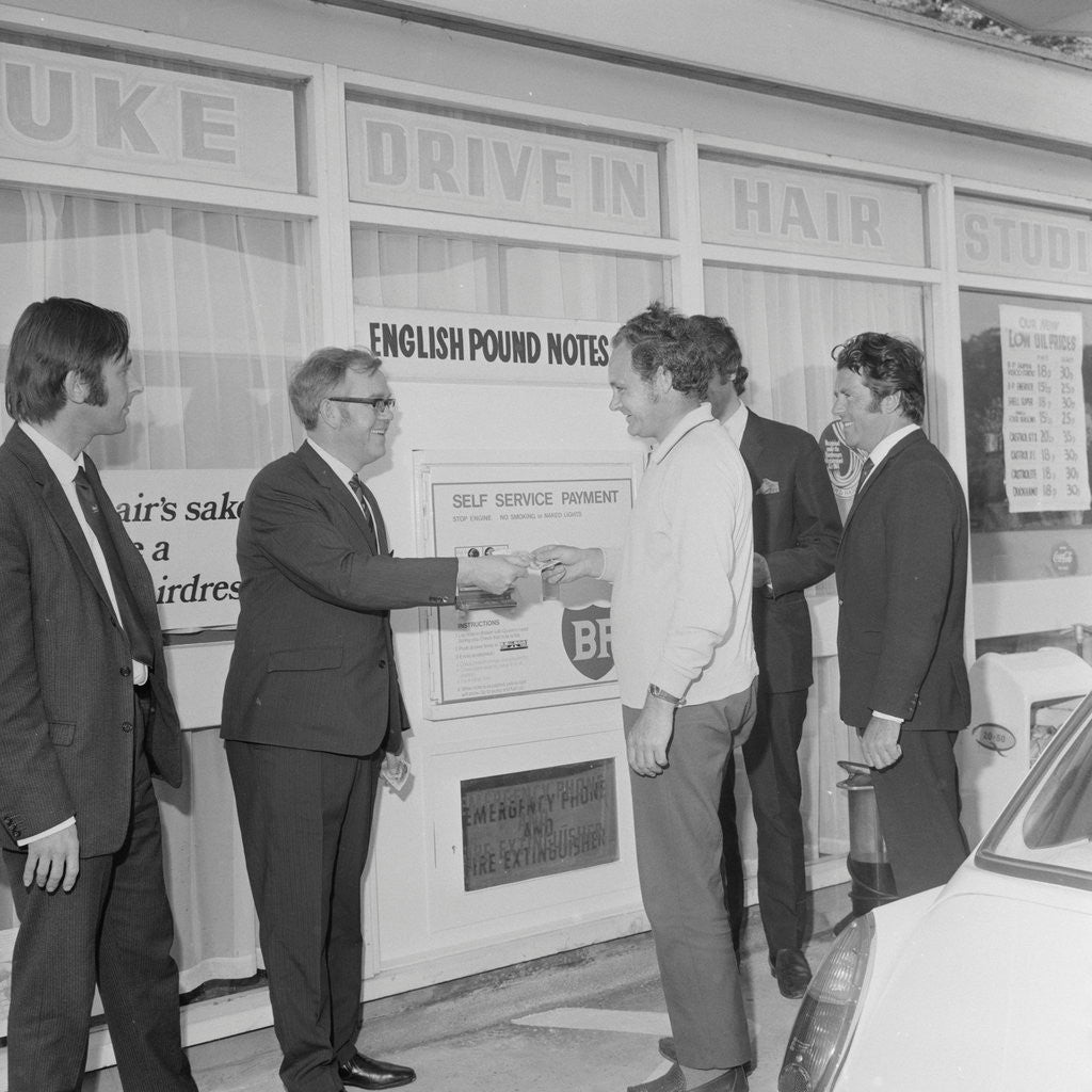 Detail of Geoff Duke at petrol station auto pay kiosk by Manx Press Pictures