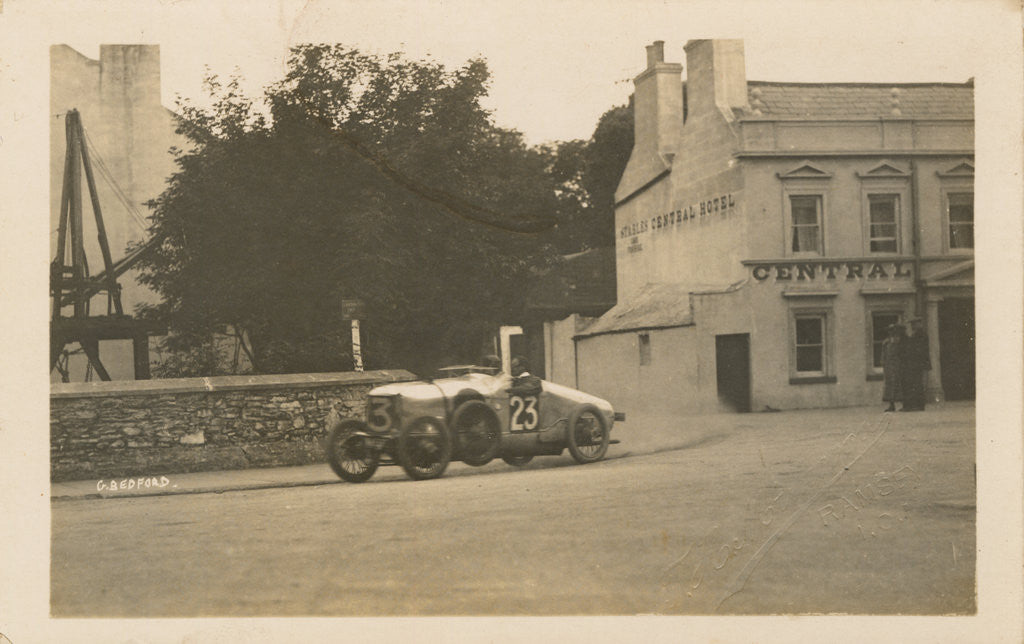 Detail of Motorcar no.23 G. Bedford in a Hillman at Parliament Square turning off Lezayre Road, Ramsey, 1922 Tourist Trophy motorcar race by Anonymous