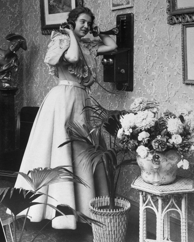 Detail of Woman Talking on Wall Mounted Telephone by Anonymous