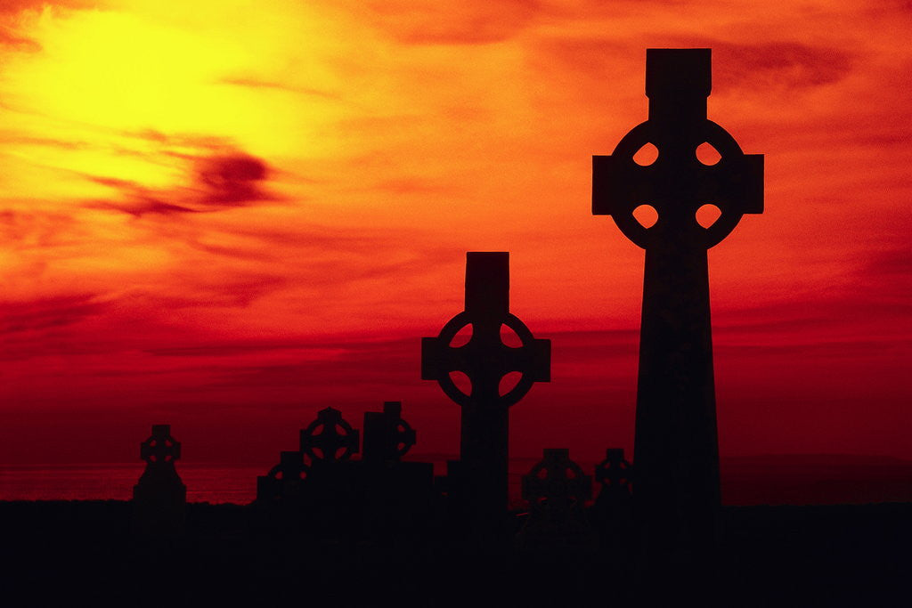 Detail of Celtic Crosses Silhouetted at Sunset by Corbis