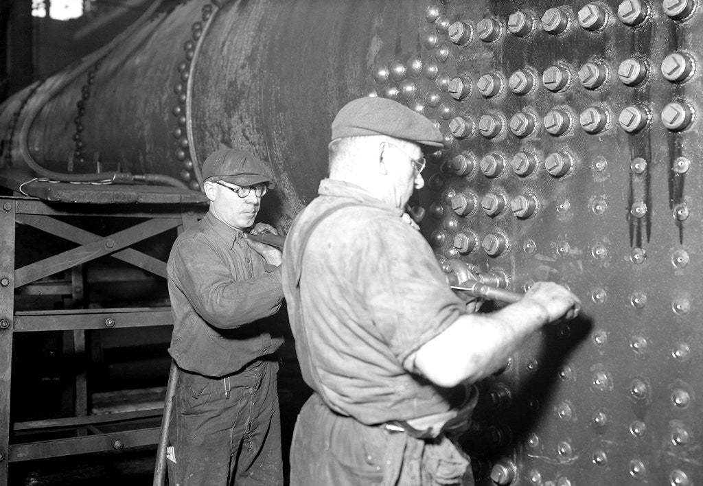 Detail of Eddystone, Pennsylvania - Railroad parts. Boilermaker and helper working on locomotive boiler, 1936 by Lewis Hine