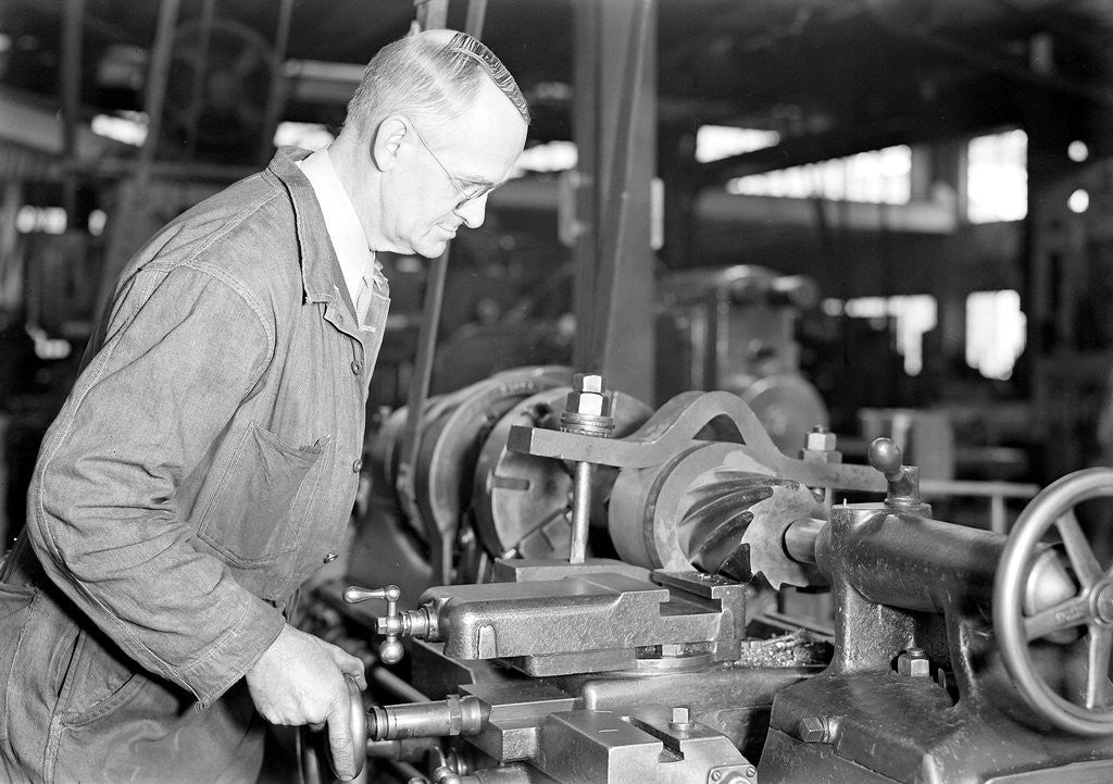 Detail of Eddystone, Pennsylvania - Railroad parts. Toolmaker making a taper sleeve gauge from a taper reamer, March 1937 by Lewis Hine