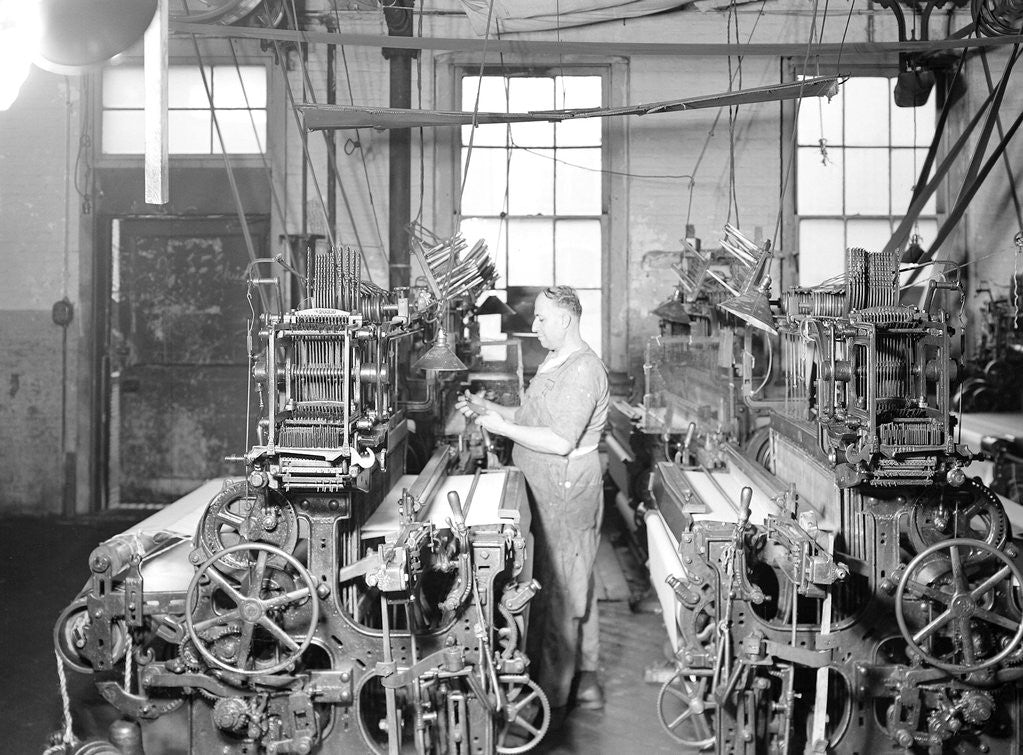 Detail of Paterson, New Jersey - Textiles. Weaver operating four-loom system. He is shown removing a used-up quill from the shuttle, 1936 by Lewis Hine