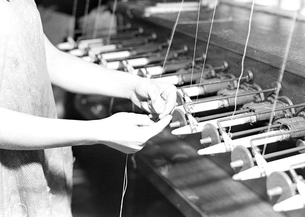 Detail of Paterson, New Jersey - Textiles. Quiller tying the broken ends of thread being wound on to quills, March 1937 by Lewis Hine