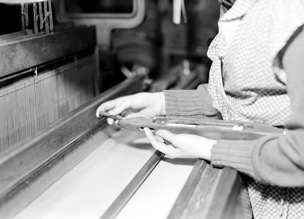 Detail of Paterson, New Jersey - Textiles. Weaver threading shuttle, March 1937 by Lewis Hine
