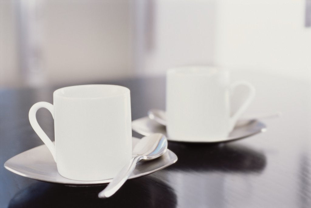 Detail of Two coffee cups on a table by Anonymous