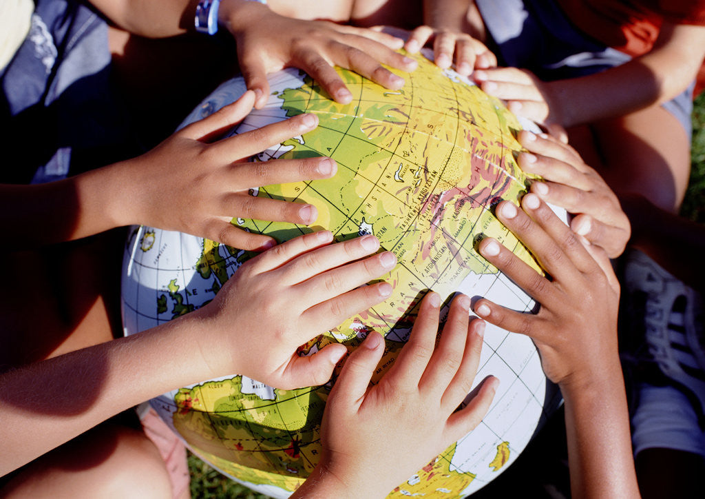 Detail of Children's Hands on Inflatable Globe by Anonymous