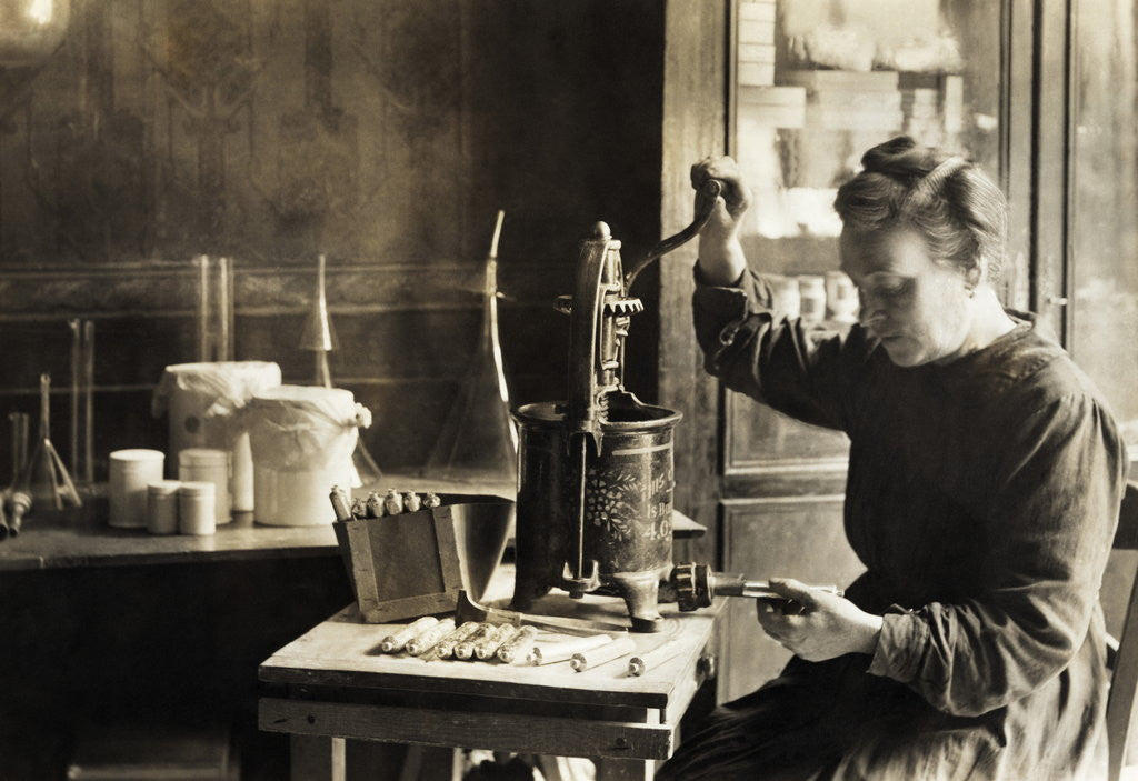 Detail of Woman Filling Toothpaste Tubes by Anonymous