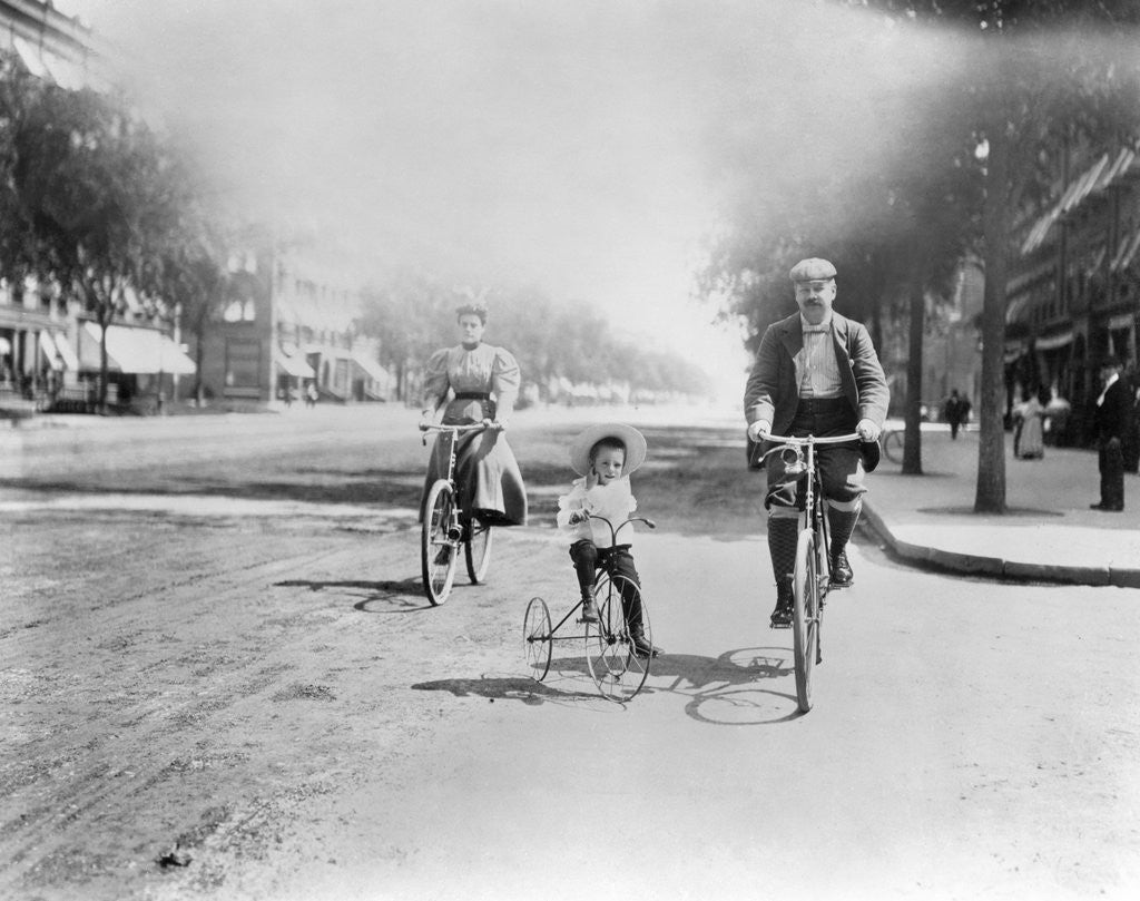 Detail of Family Riding Bikes by Corbis
