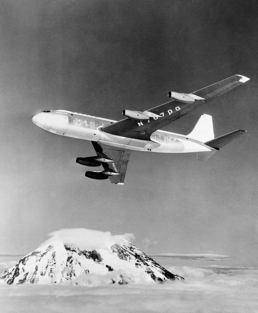Detail of Large Aircraft Flying over Mountainous Region by Anonymous