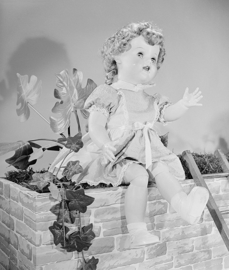 Detail of A Doll Sitting on a Wall by Corbis