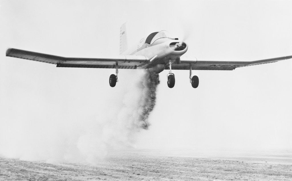 Detail of Crop Dusting Airplane in Flight by Anonymous