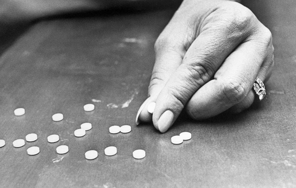 Detail of Hand Holding Pills Containing Thalidomide by Anonymous