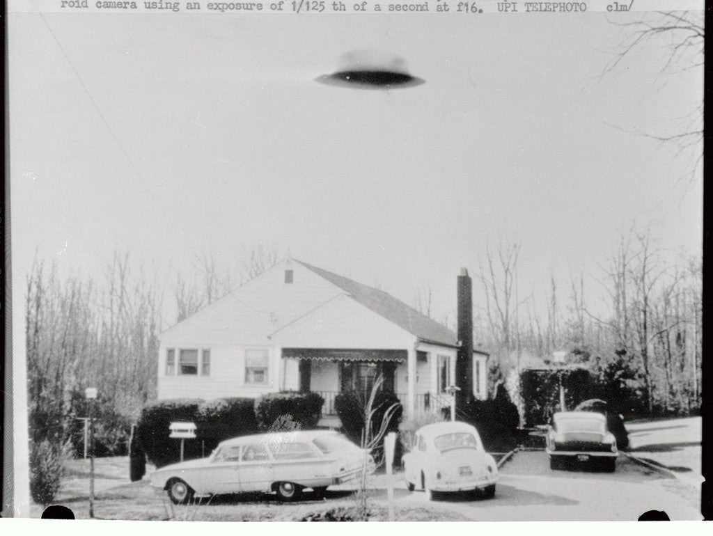 Detail of Supposed Unidentifiable Flying Object over House by Corbis
