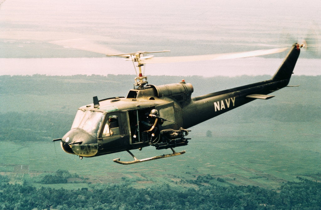 Detail of American Gunners Firing from Helicopter in Vietnam by Corbis