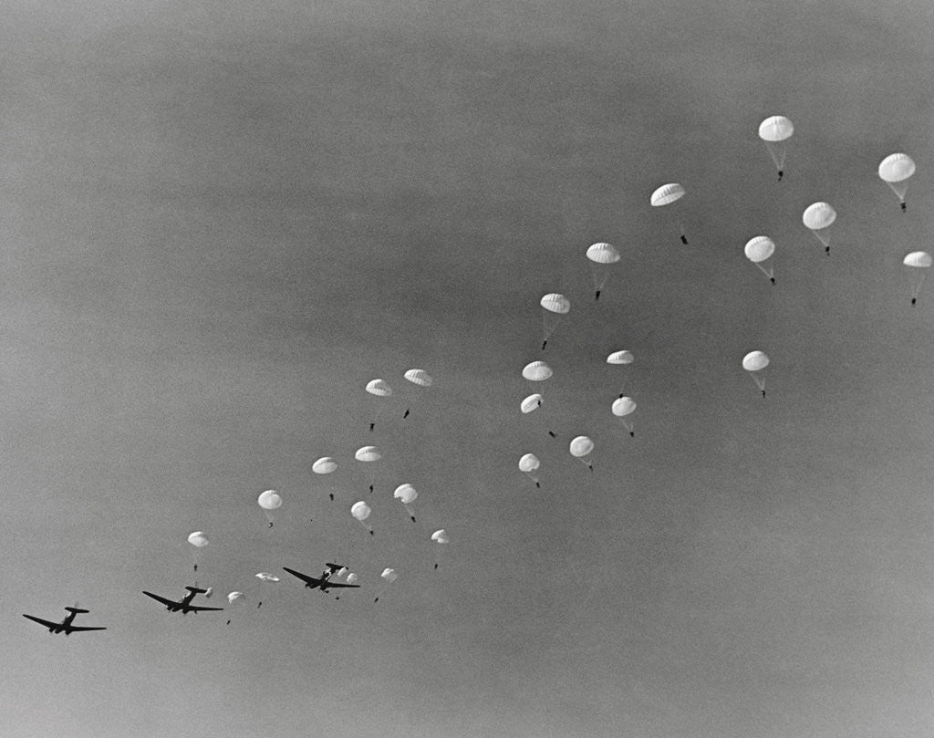 Detail of Parachutes and Military Planes in the Sky by Corbis