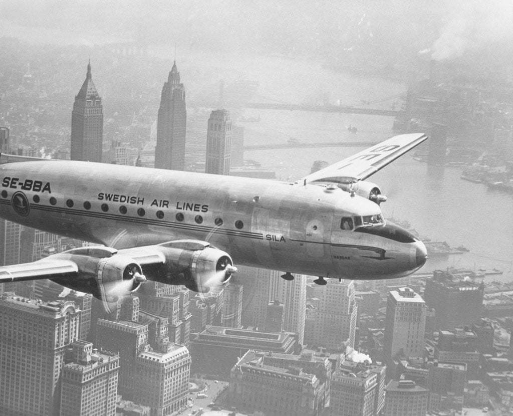 Detail of Aircraft Flying over City by Anonymous