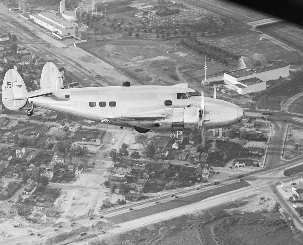 Detail of Howard Hughes Lockheed 14 Super Electra over Worlds Fair Site by Anonymous