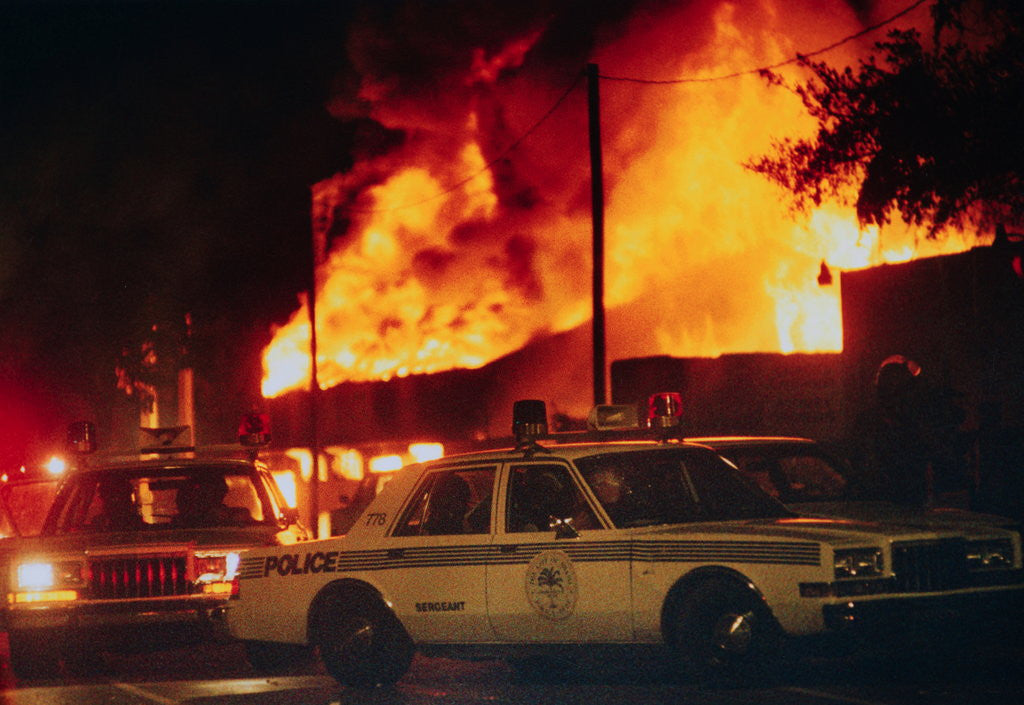 Detail of Burning Buildings with Police on the Scene by Anonymous