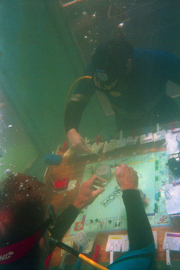 Detail of Divers Playing Monopoly Underwater by Anonymous
