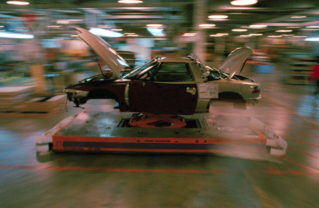 Detail of Partially Assembled Car Moving Through Work Station by Anonymous