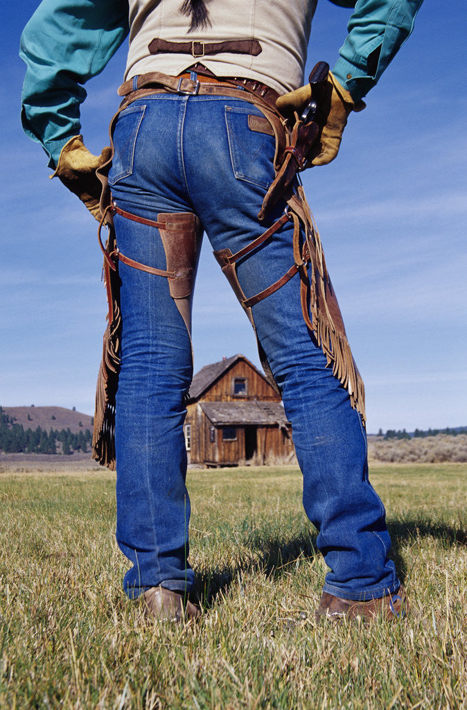 Detail of Cowboy Outside Homestead by Corbis