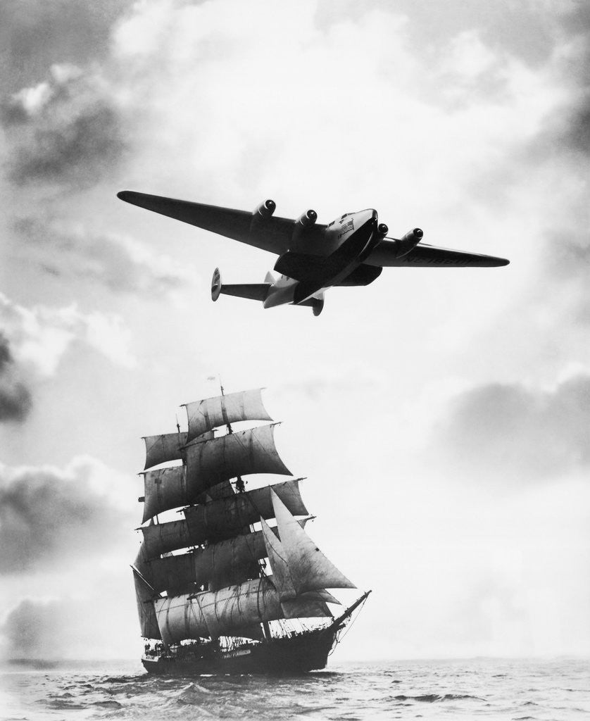 Detail of Airplane Flying over Ship by Corbis
