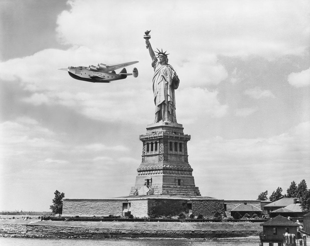 Detail of Seaplane Flying by Statue of Liberty by Anonymous