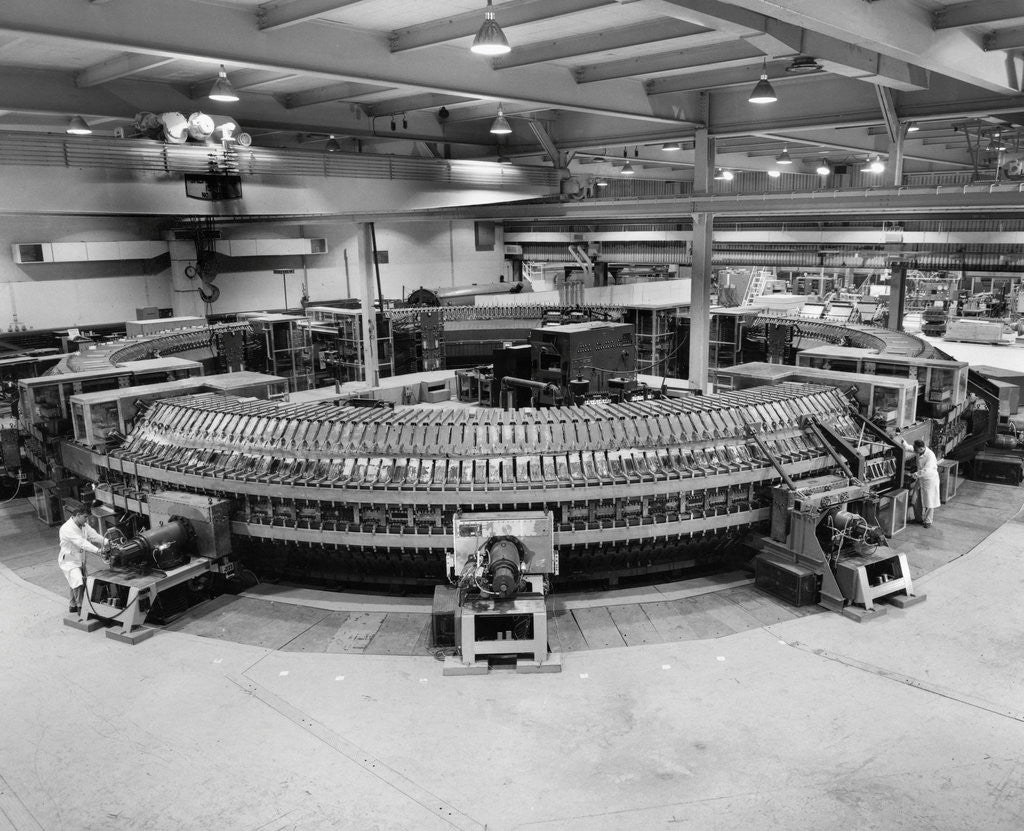 Detail of Technicians Near Circular Electronic Device by Anonymous