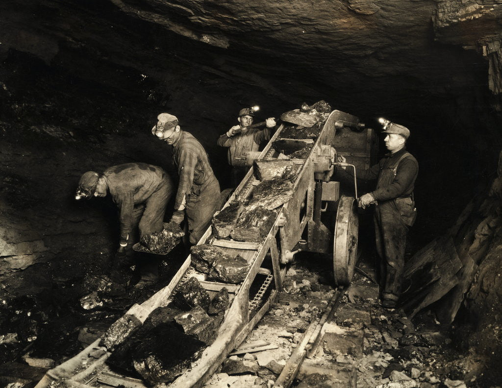 Detail of Coal Miners Using Automatic Conveyor by Corbis