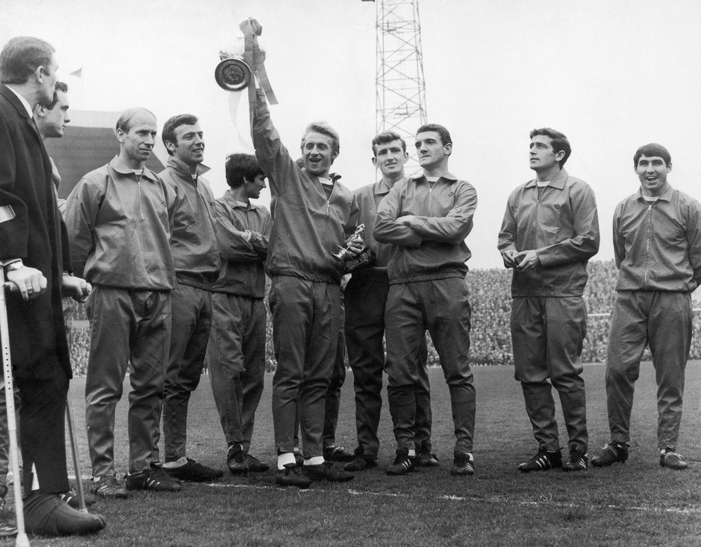 Detail of Dennis Law holding the Division One Championship trophy by Staff