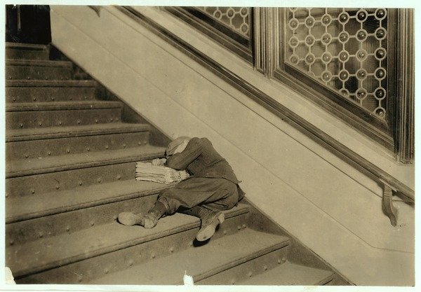 Detail of Newsboy asleep with his papers in Jersey City, New Jersey, 1912 by Lewis Wickes Hine