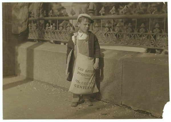 Newsboy Freddie Kafer, 5 or 6 years old, selling Saturday Evening Posts at the entrance to the State Capitol, Sacramento, California, 1915 by Lewis Wickes Hine