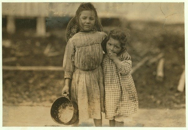 Detail of Maud and Grade Daly, 5 and 3 years old pick about a pot of shrimp each day for the Peerless Oyster Company, Bay St. Louis by Lewis Wickes Hine