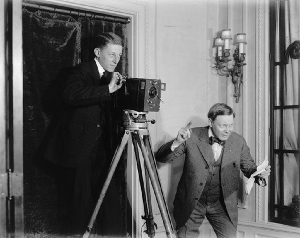 Detail of Two men using a movie camera indoors, c.1908-20 by Detroit Publishing Co.